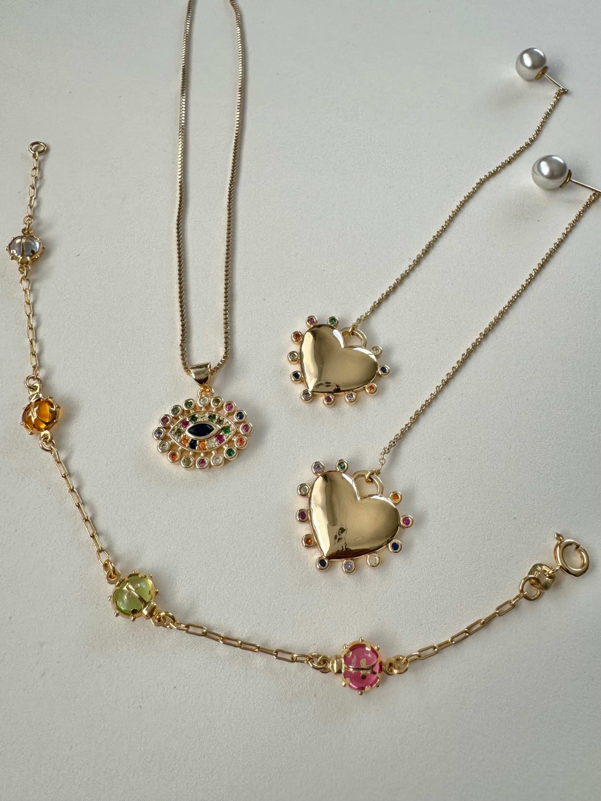 Rave Pendant, Fana Earrings, June Bug Bracelet